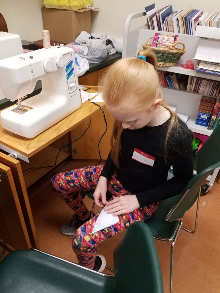 Young 4-Hers sewing