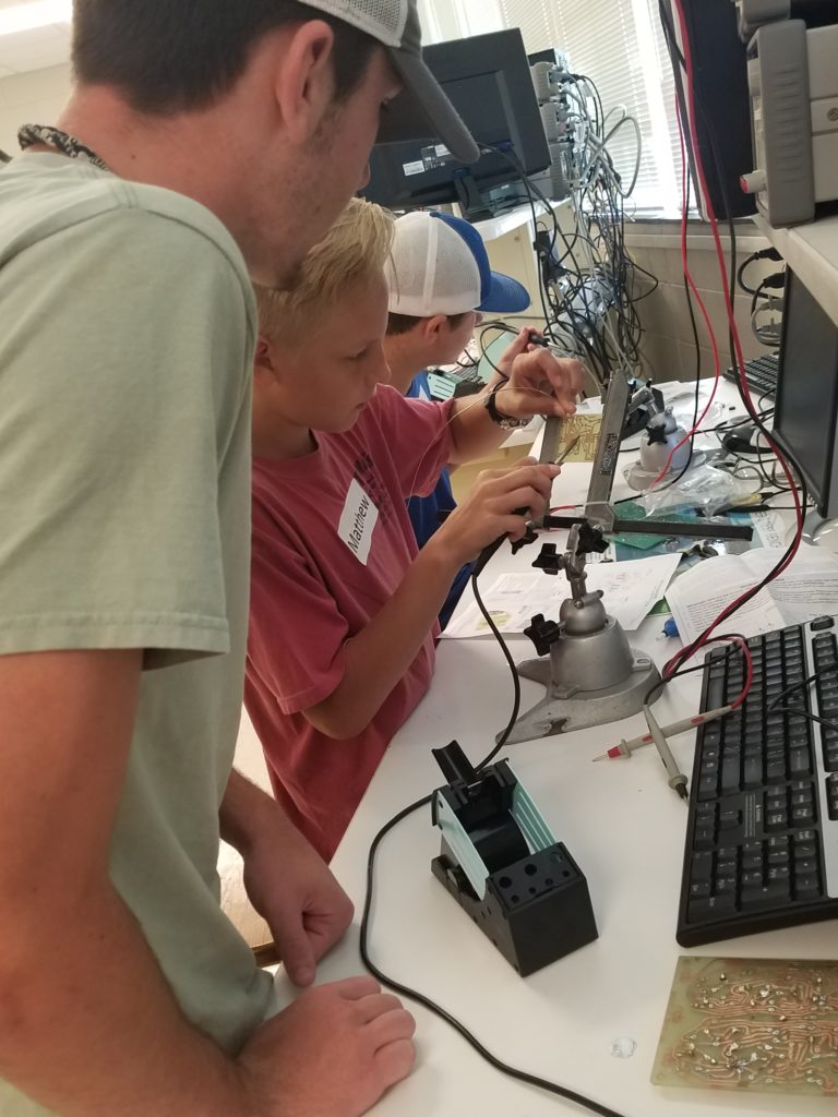 Youth working on a circuit