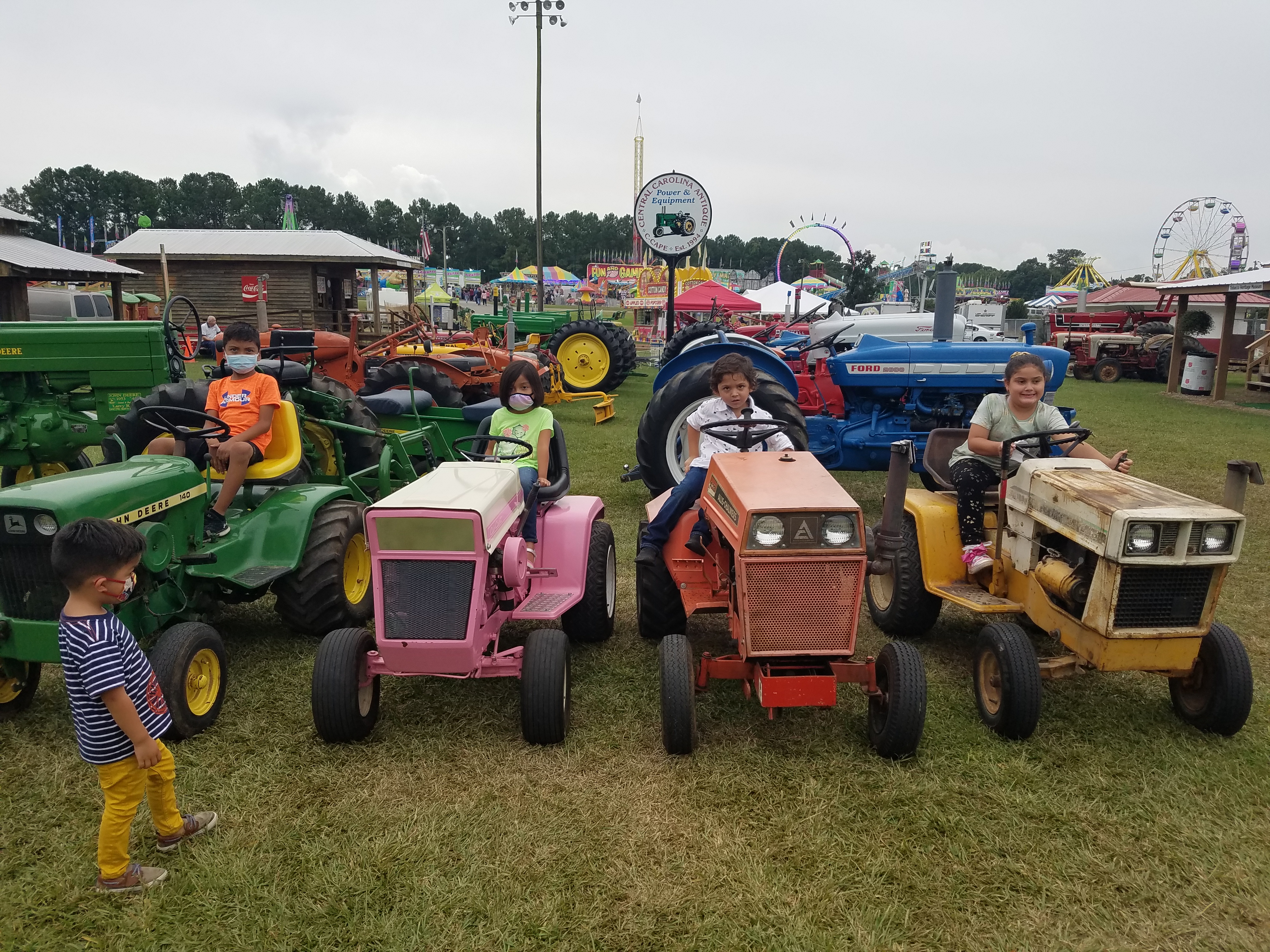 4-H cloverbuds on the lions field tractor exhibit