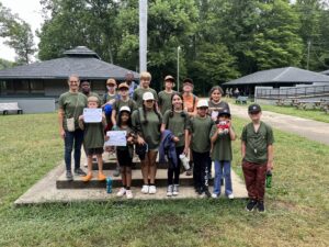 lee county campers standing at the flag pole of Betsy Jeff Penn